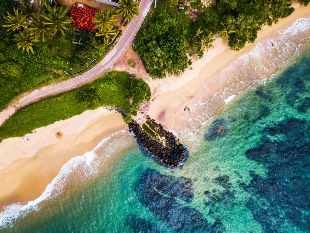 Golden beach and reef from above
