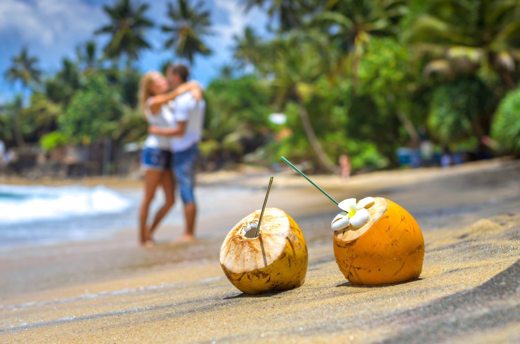 Couple on a palm-fringed beach